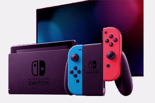 Imagem do video-game  Nintendo Switch original e uma tv no fundo. 